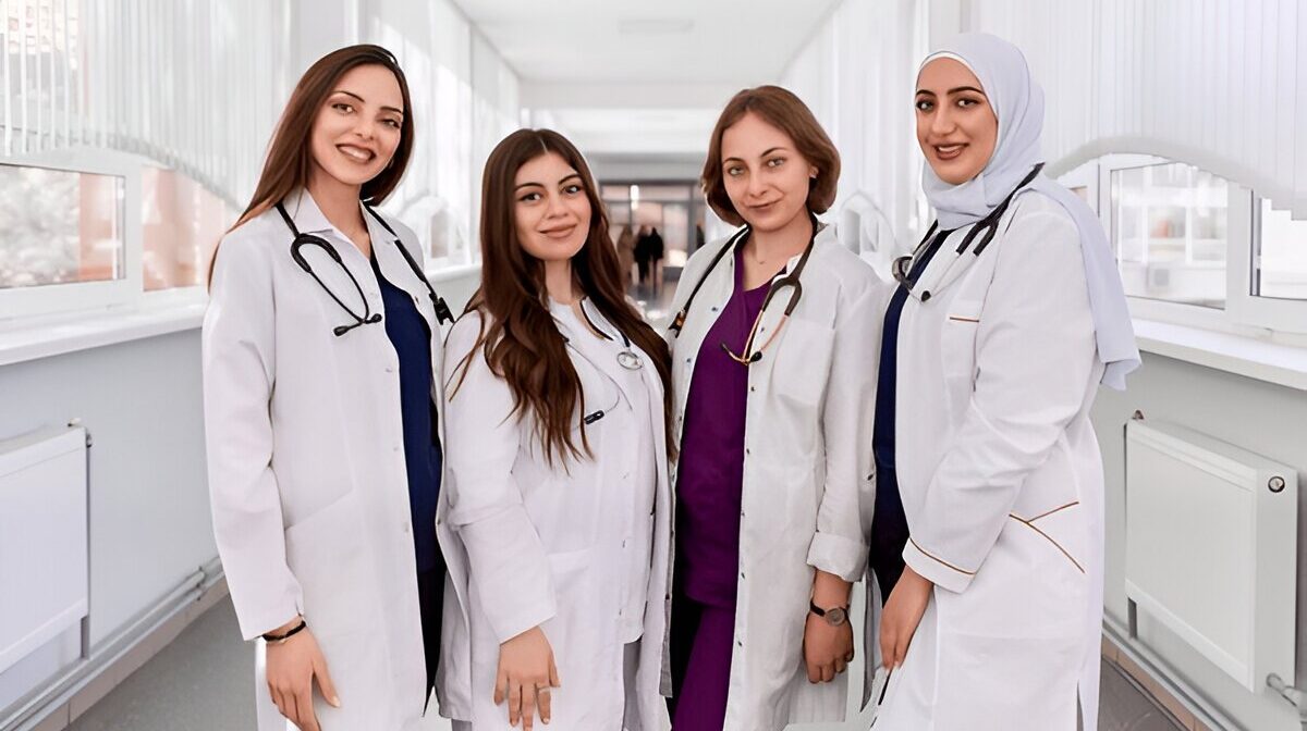 Group of women doctors standing confidently in a hospital hallway